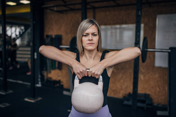 istock Woman exercising with kettlebell 1469517789