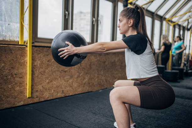 istock Woman training with medicine ball 1469519363
