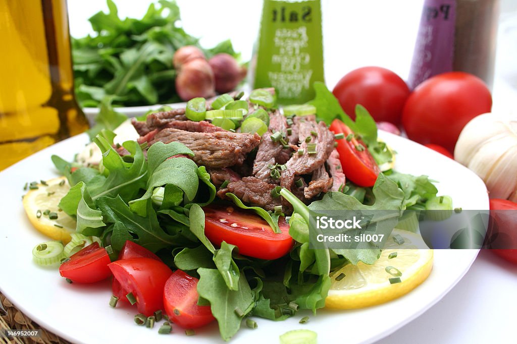 fresh rucola with tomatoes and beef Appetizer Stock Photo
