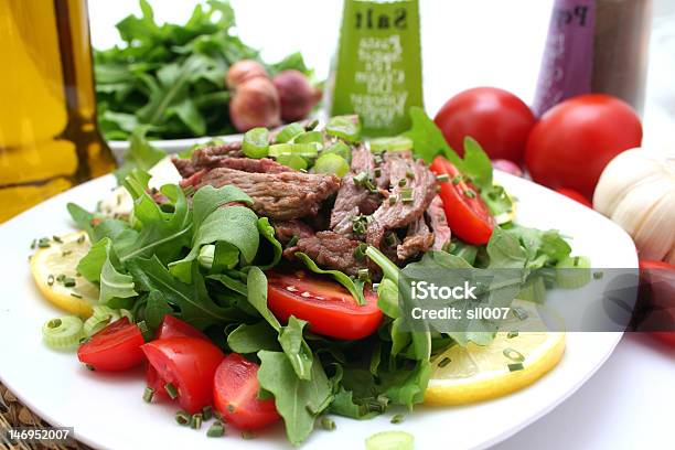 Fresh Rucola With Tomatoes And Beef Stock Photo - Download Image Now - Appetizer, Arugula, Fillet Steak