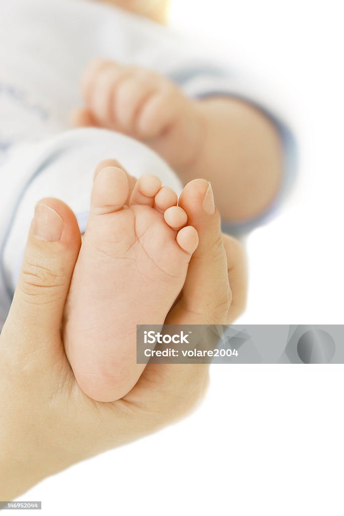 Pie de bebé en manos del original en blanco - Foto de stock de Adulto libre de derechos