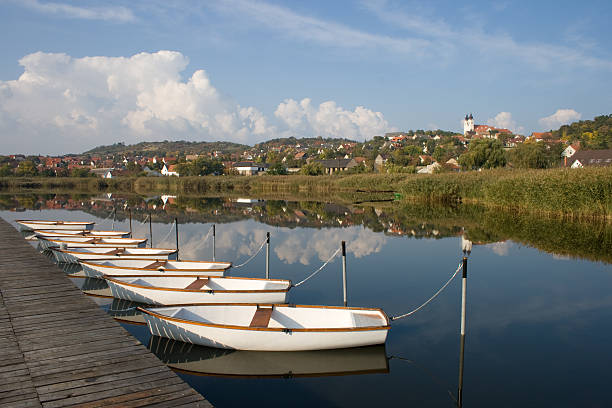 A reflection view of Tihany with white boats near to lake Balaton, Hungary.