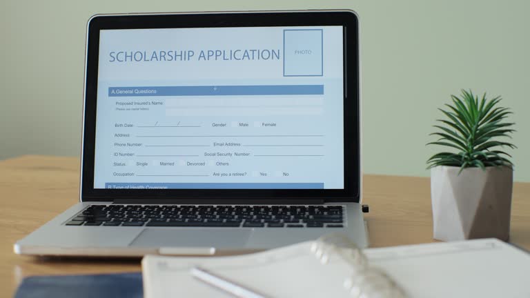 Laptop computer with an Scholarship Application form on its display.