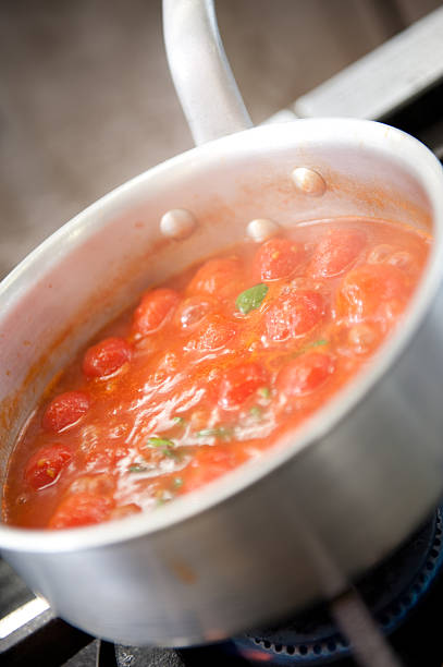 Tomato under cooking stock photo