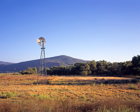 An old windmill for a water well in the dry foothills of southern California.