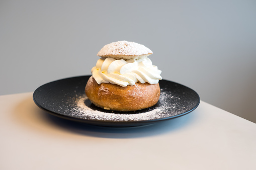 Semla bun is sweet cardamom bun filled with whipped cream and jam or almond paste. Made only in February during holidays.
