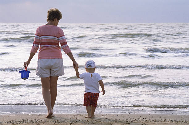 istock child and mother on a beach 146952919
