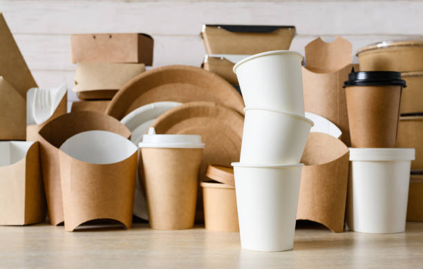 istock A stack of white paper cups on the background of eco-friendly disposable tableware. Zero waste concept, selective focus 1469529317