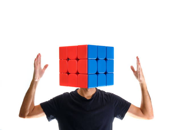 man with rubik's cube instead of his head with arms up on pure white background