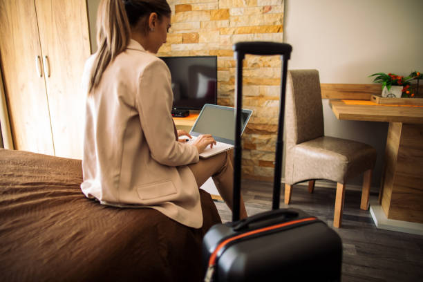 istock Young woman just arrived in rented apartment and using laptop 1469530689