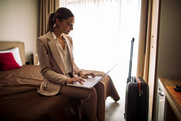 istock Young woman just arrived in rented apartment and using laptop 1469530701