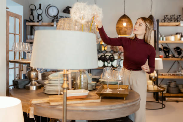 Woman Arranging Home Accessories in Home Decor Store
