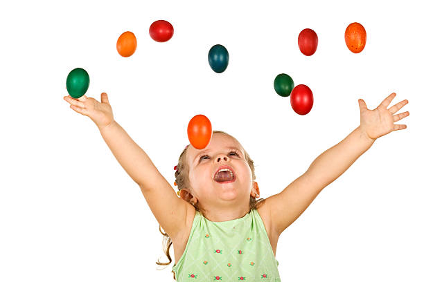 istock Happy shouting little girl with falling easter eggs 146953386
