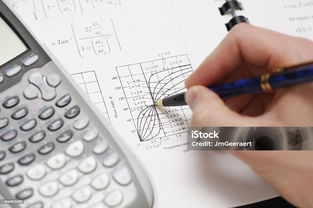 Engineer at Work Engineer or Mathematician at work. Blueprint Stock Photo