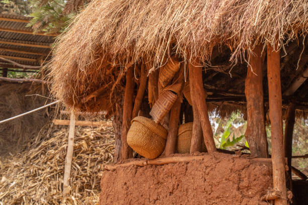 Karatu, Tanzania - October 16th, 2022: Hand made wicker baskets in a traditional hut made of mud, branches and straw, in suburban Karatu, Tanzania.