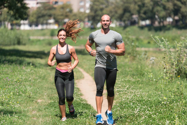 istock Couple Runner Running City Park 1469535299