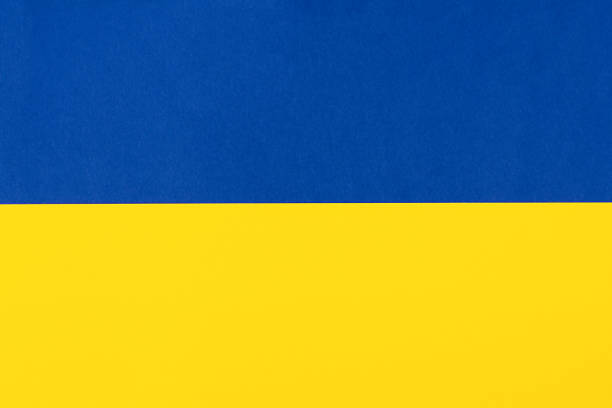 istock Blue and yellow paper background 1469536383