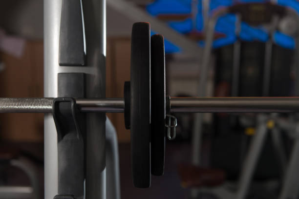 Barbell and Weights at the Modern Gym Room Fitness Center