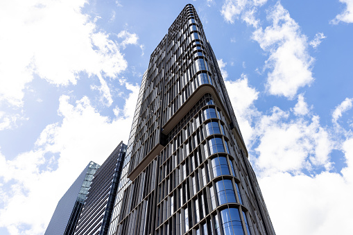Low angle view of modern office building skyscrapers, Parramatta NSW, sky background with copy space, full frame horizontal composition