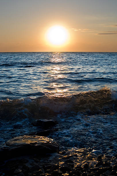 Sunset over the quiet sea stock photo