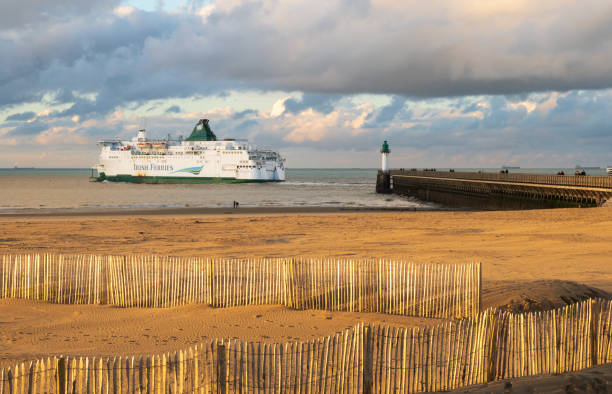 Calais, France - january 02 2023 : Beautiful landscape of the coast and harbor with the departure of a ferry in Calais, north of France