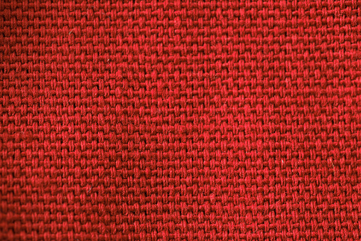 A red fabric with a black and red pattern