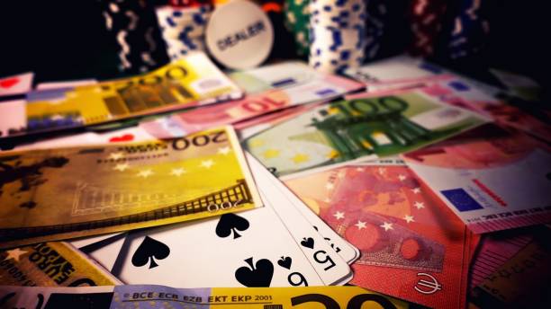 istock Game Gambling Money Chips and Poker Cards 1469539588