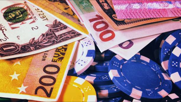 istock Game Gambling Tools Money Poker Chips and Money 1469540294