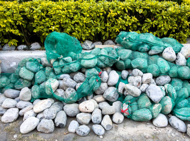 River pebbles used for repairing a road paved with river stones in San Angel Neighborhood, southwest of Mexico City