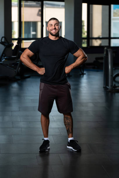 istock Muscular Man Posing In Black T-shirt 1469540318