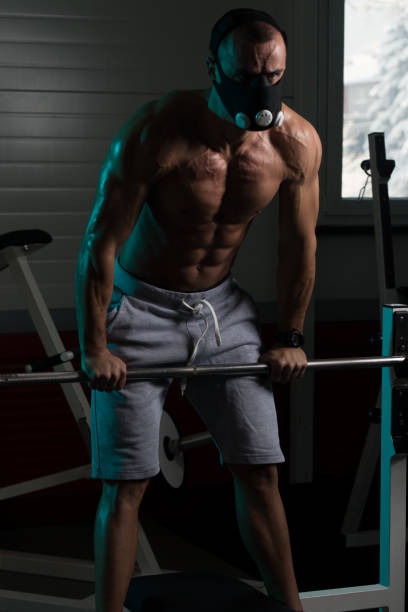 istock Athlete Exercising Push-Ups On Barbell In Elevation Mask 1469540483