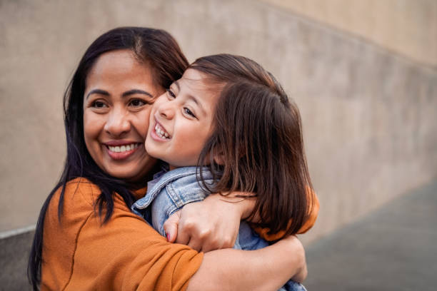 happy asian mother and daughter having fun together outdoor - focus on mom hands - índia imagens e fotografias de stock