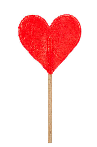 red hear shaped lollipop stock photo