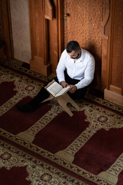 istock Muslim Man Is Reading The Koran 1469542218