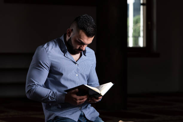 istock Muslim Man Is Reading The Koran 1469542247