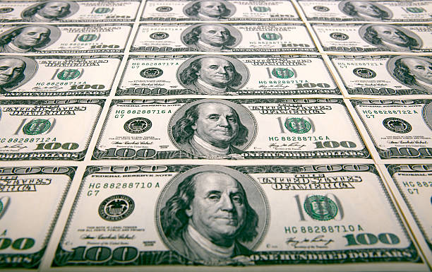 istock fifteen notes by dignity 100 dollars 146954465