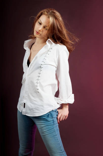 istock Sensual woman, model sits in jeans 1469544702