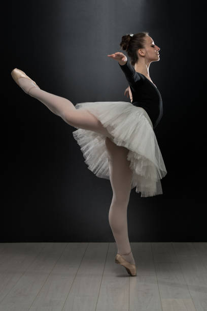 istock Young Ballerina Dancer In Tutu Performing On Pointes 1469545915