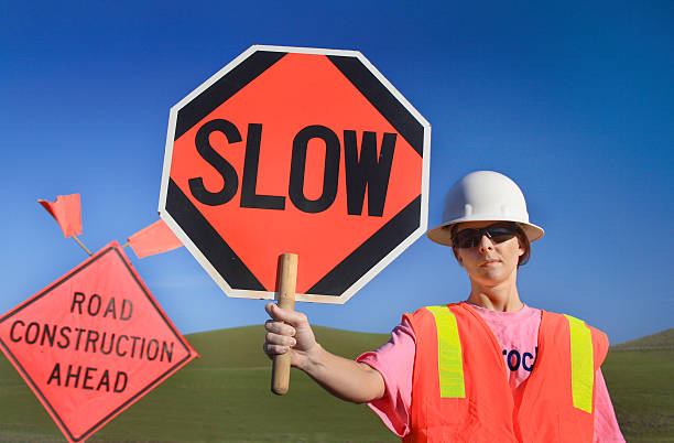 istock Woman Construction Worker with Slow Sign 146954669