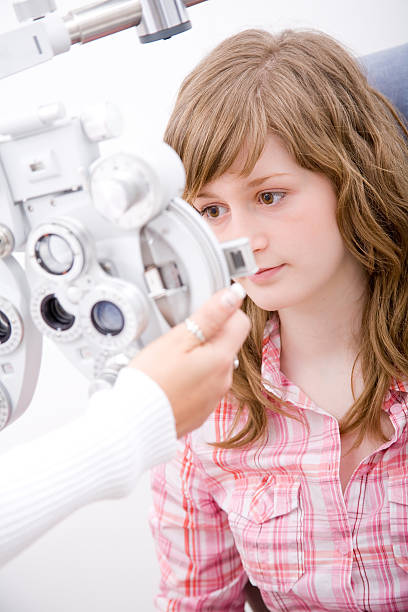 istock Inspecting patient in ophthalmology labor 146954748