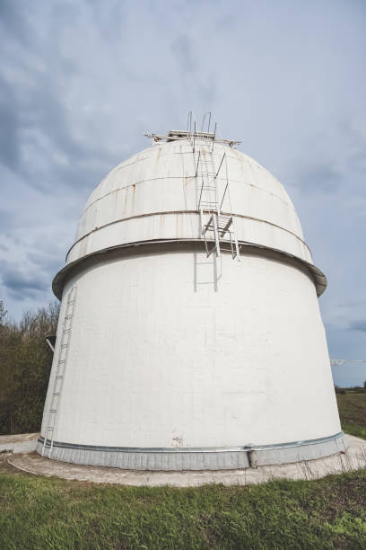 istock Astronomical observatory radio telescope design in the fields in early spring in cloudy weather, a telescope in the Kharkiv region 1469547726