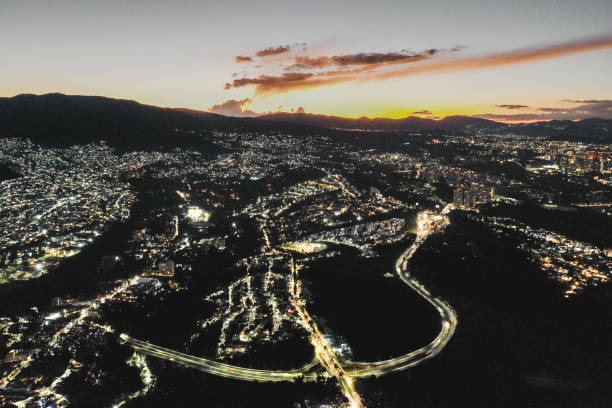 Areal shot of Mexico City at sunset/night around the city center.