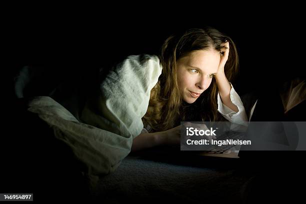 Laptop In Bed Stock Photo - Download Image Now - 20-29 Years, Adult, Adults Only