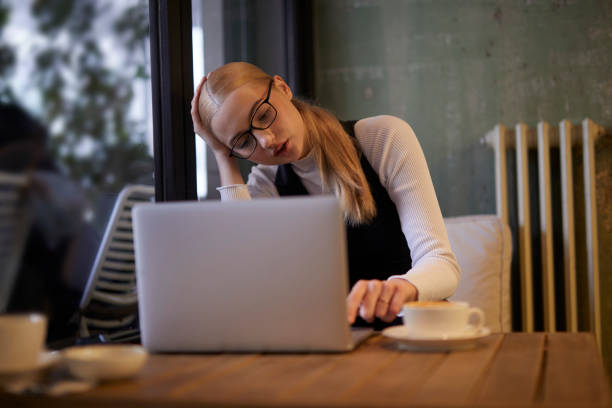 istock young lady working on computer at a stylish cafe 1469552917
