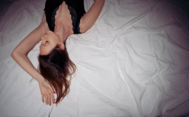 istock Top view of woman sleeping in bed 1469554145