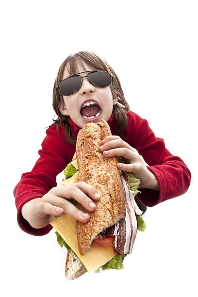 istock girl eating sandwich 146955423