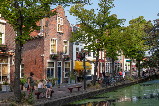 Delft, Netherlands, August 25, 2022; Tourists stroll through the narrow streets of Delft.