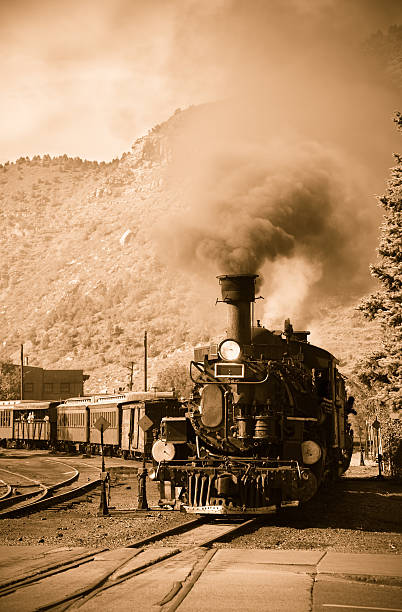 Antique steam locomotive in motion stock photo