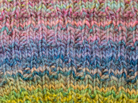 Hand knitted multi coloured background