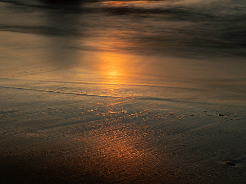 Setting sunlight on sand